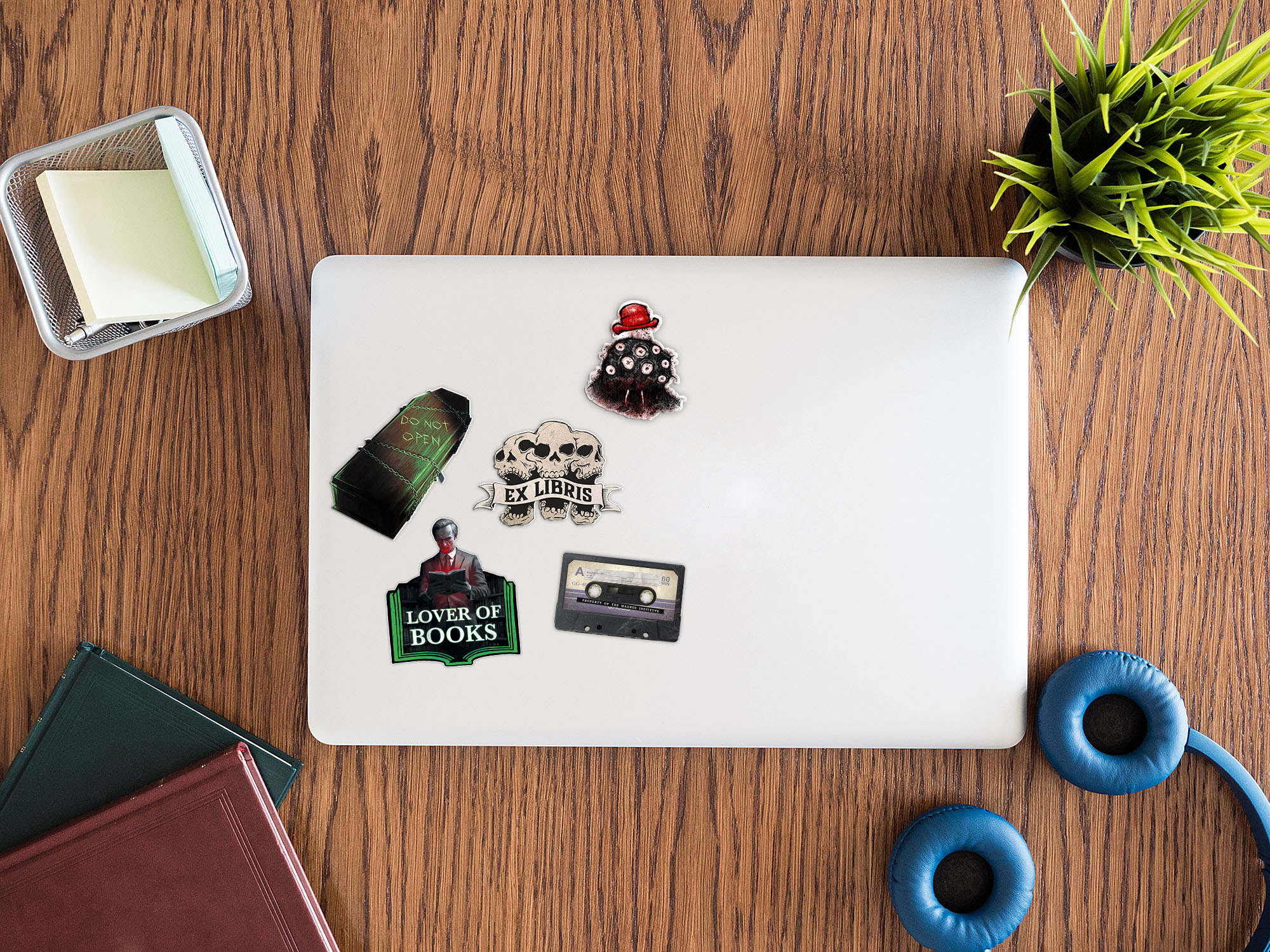 Image showing a laptop with five stickers on it.