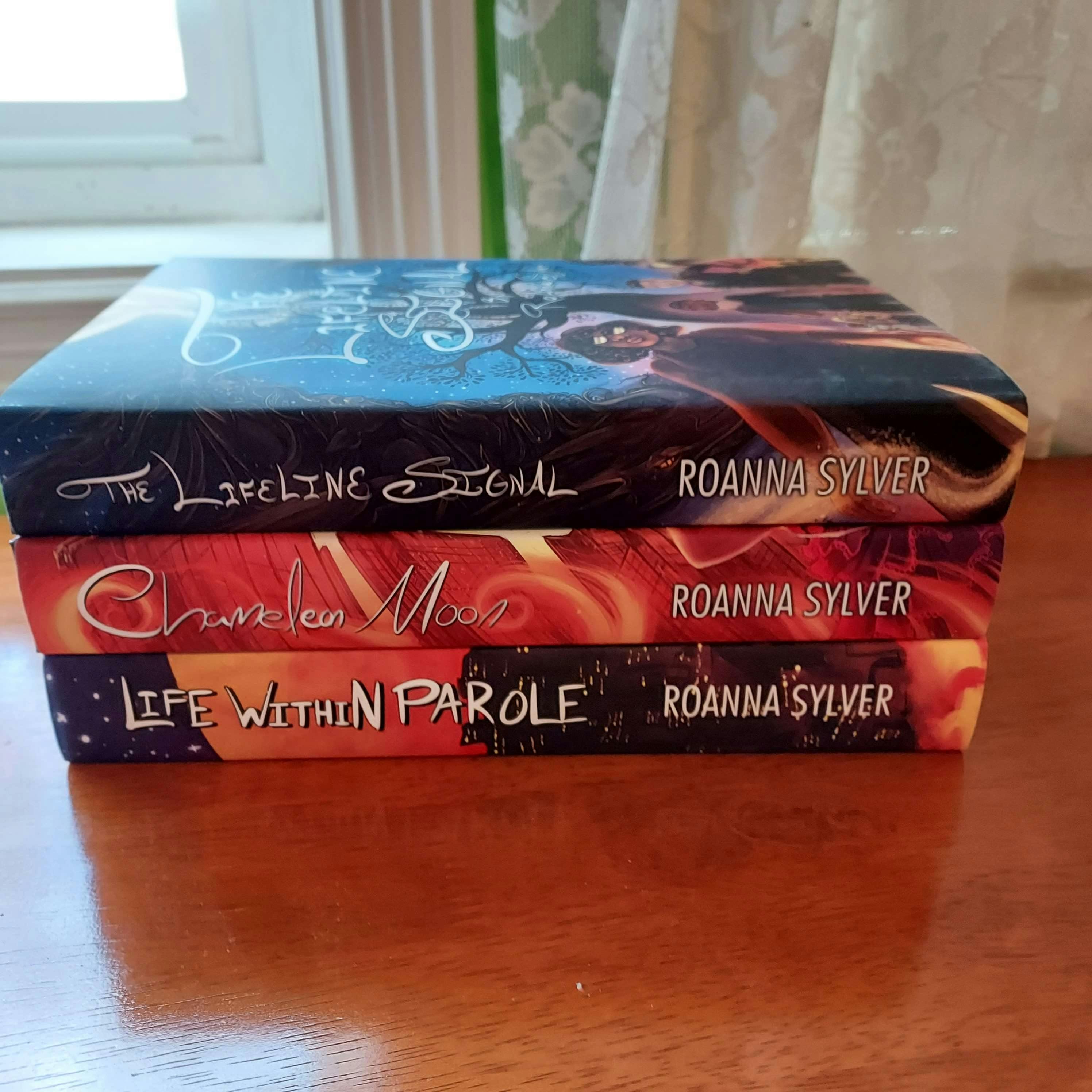 All 3 existing hardcovers, stacked