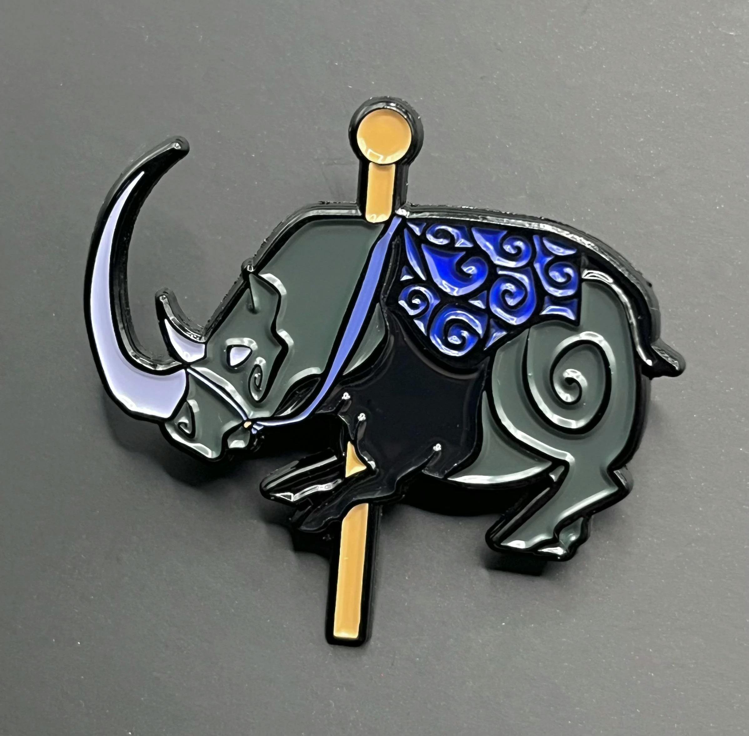 Cave art rhino carousel pin
