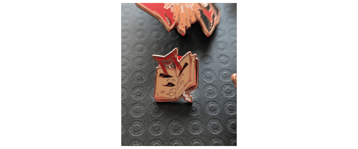 Photo of the pin freebie: the torii in an open book