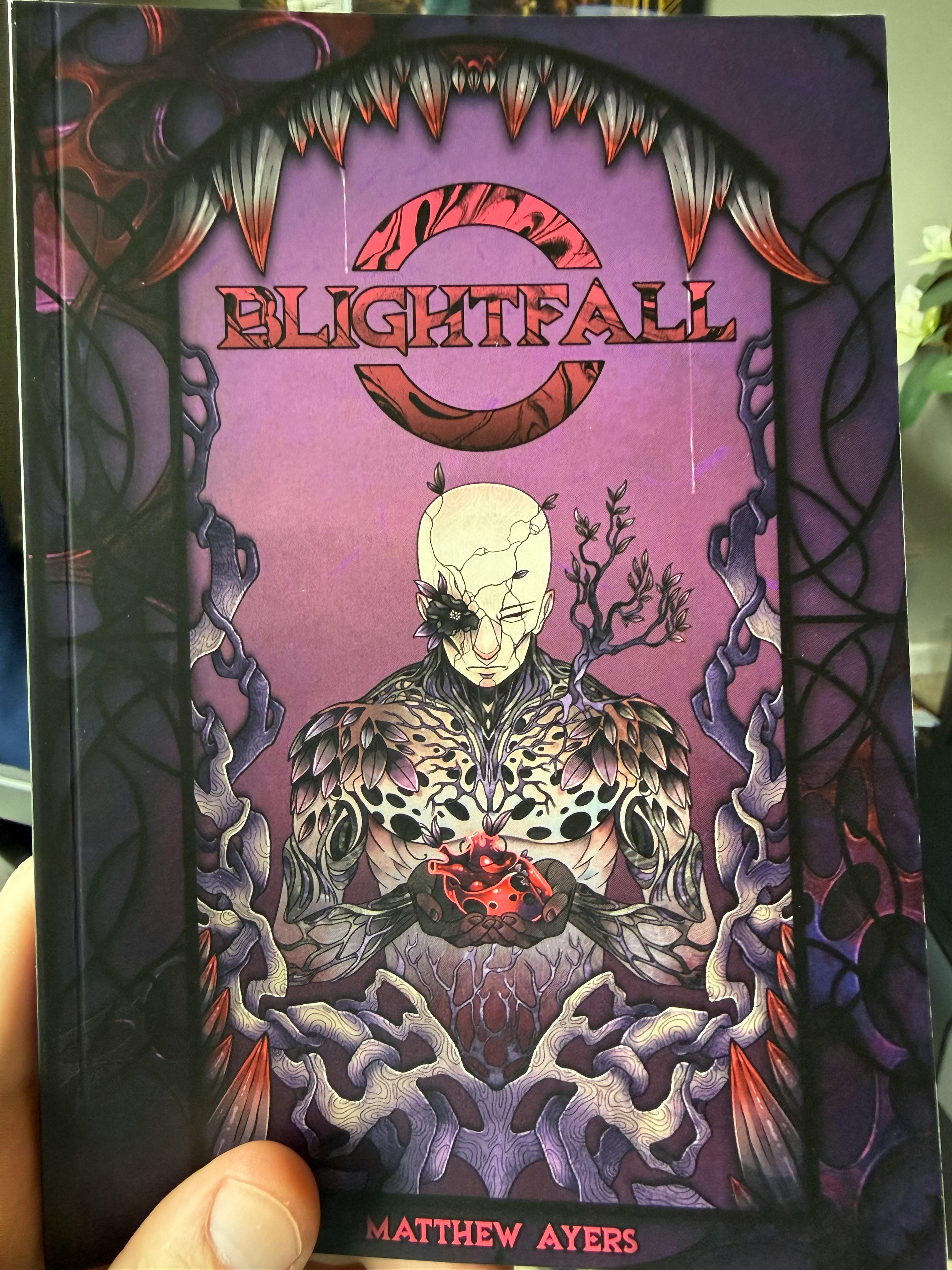 Print proof copy of Blightfall held in my hand.