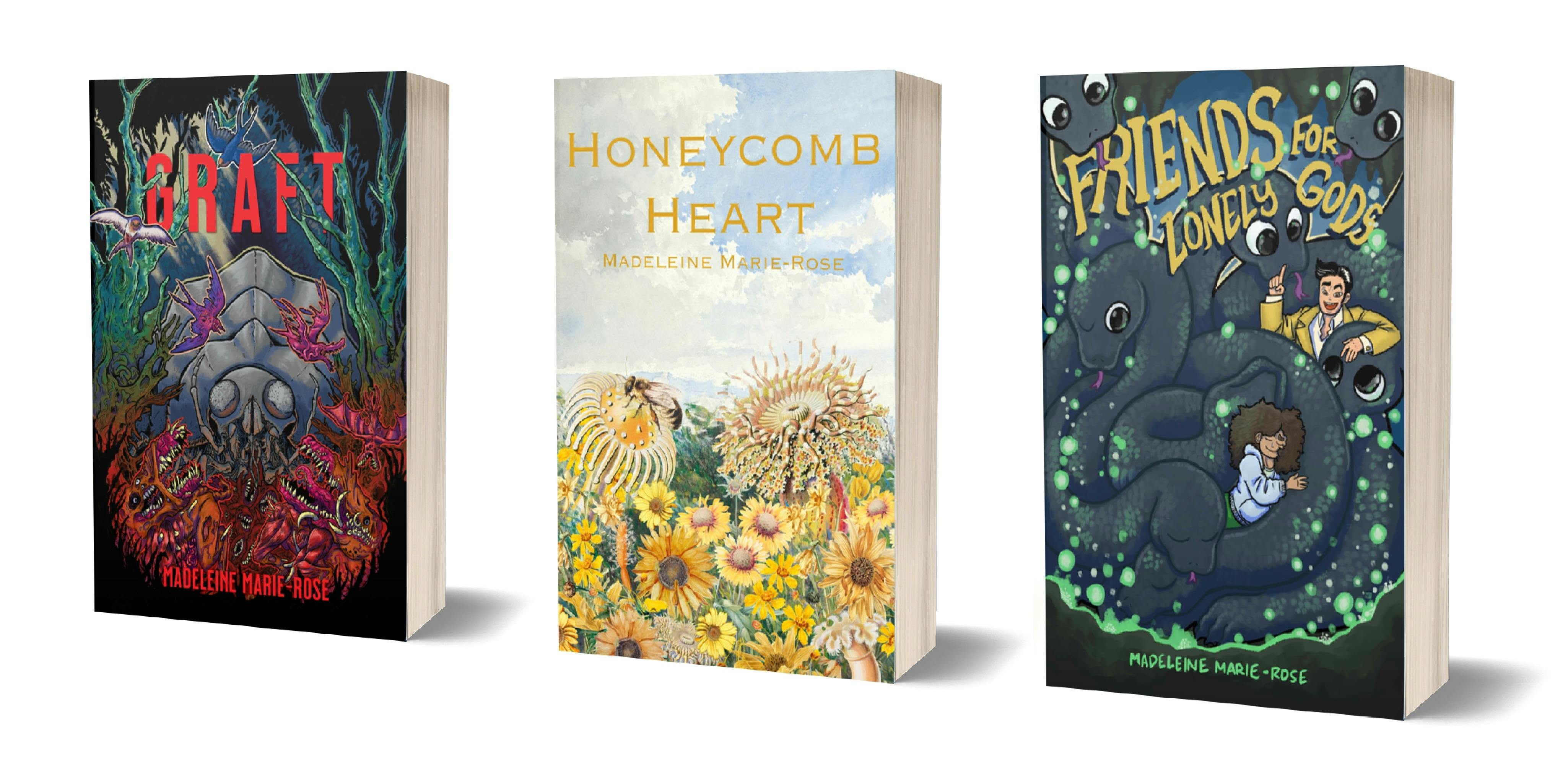 Three books—Graft, Honeycomb Heart, and a placeholder cover for Friends for Lonely Gods—lined up together 