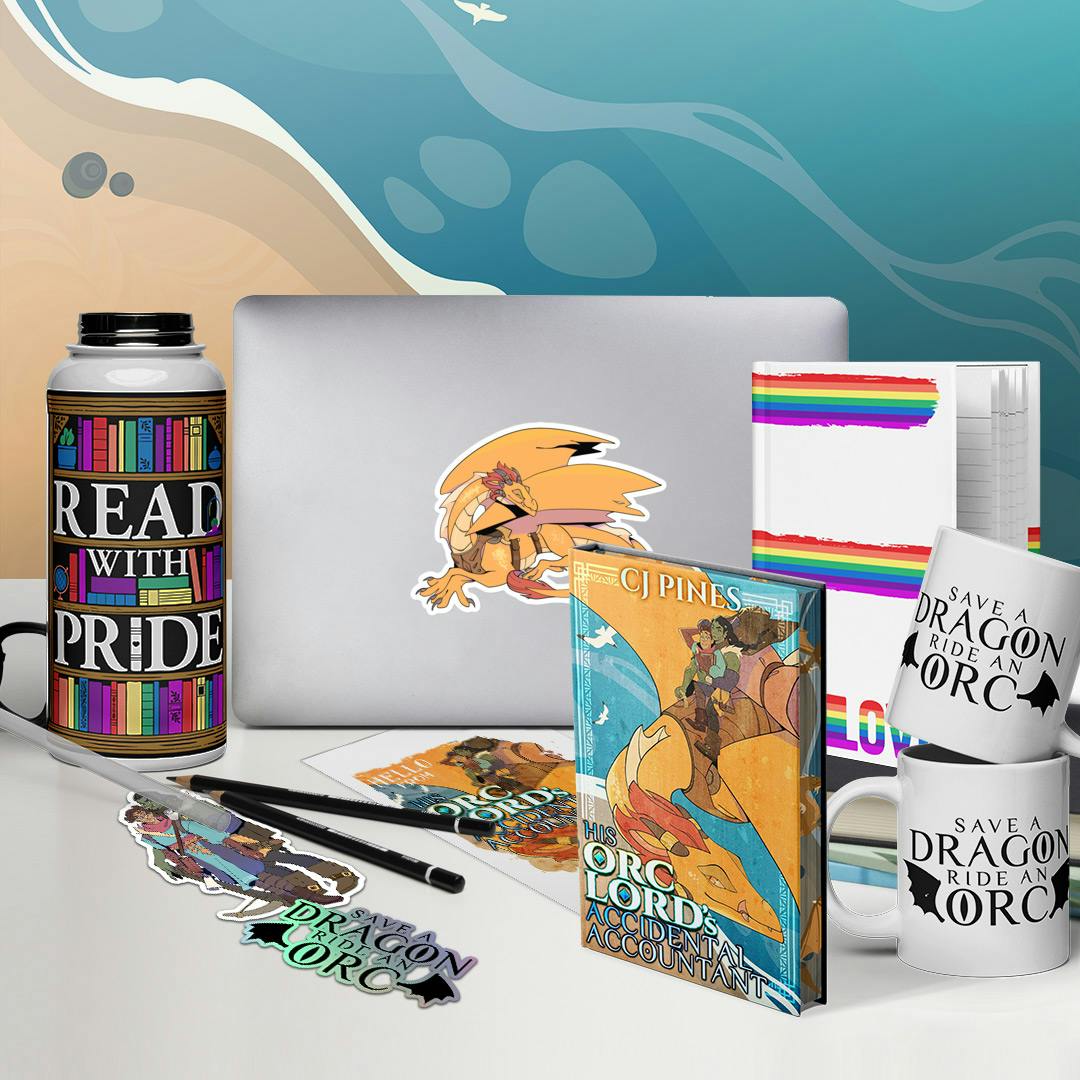 A table displaying a laptop bearing a sticker of the golden dragon Atago, a hardcover of His Orc Lord's Accidental Accountant, a water bottle with straw emblazoned with the 'Read with Pride' design featuring a rainbow-themed bookcase full of books, stickers of Tal (human) & Sural (Orc), a destination postcard, coffee mugs and a sticker saying 'Save a dragon, ride an orc', and a hardback notebook with rainbows making up the word 'LOVE'.