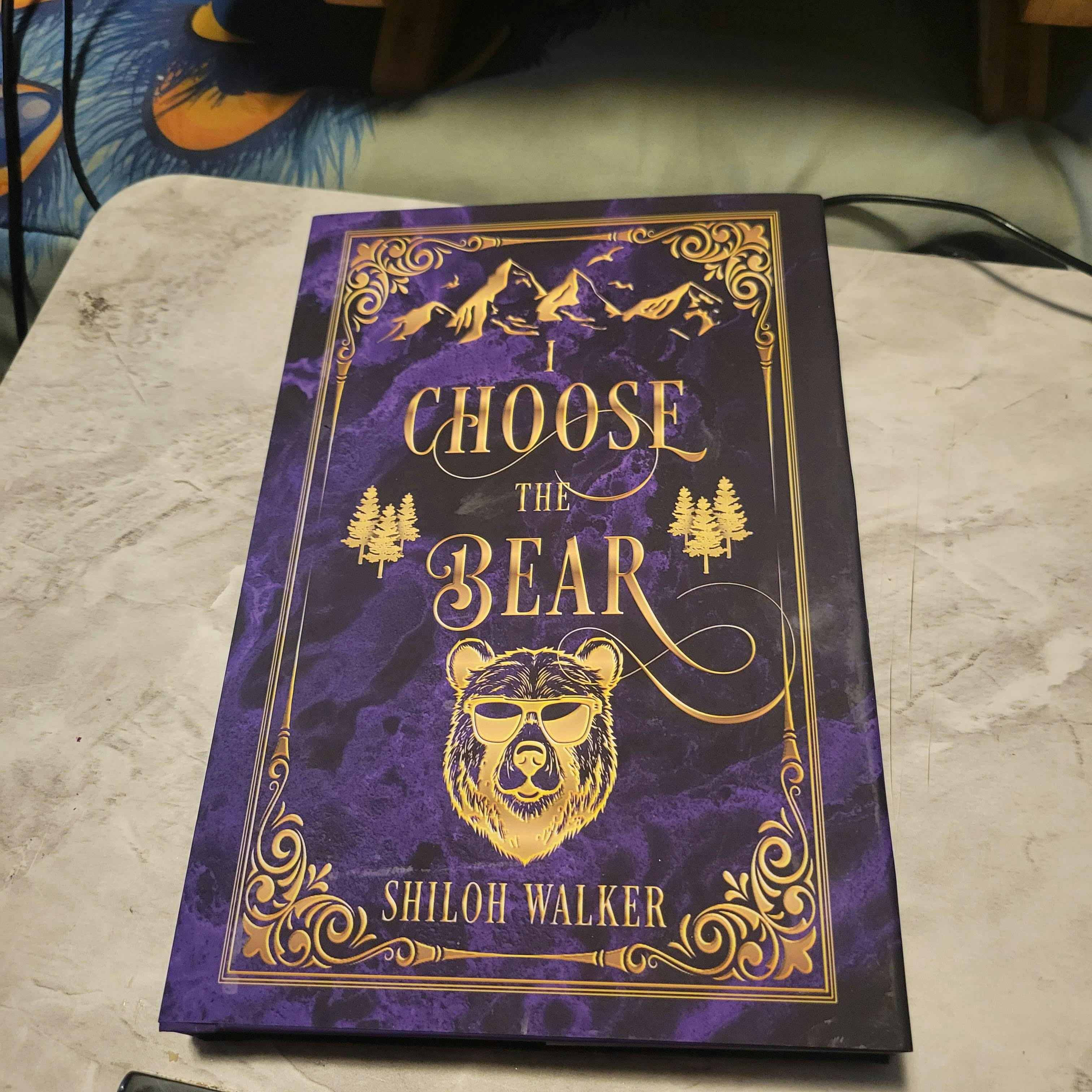 purple hardback, I Choose the Bear, has a bear with sunglasses, gold filigree elements