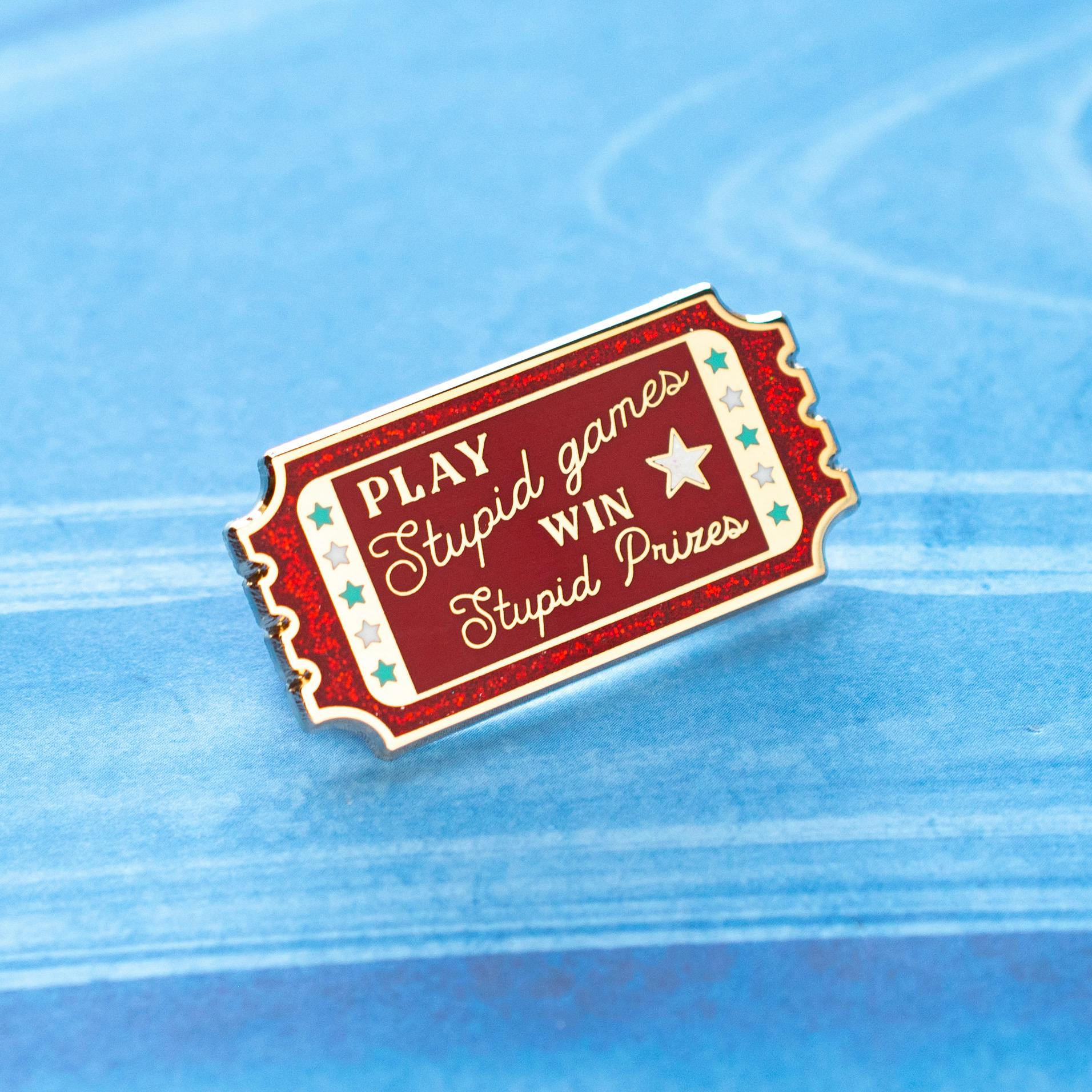 Play Stupid Games Pin - Red Glitter