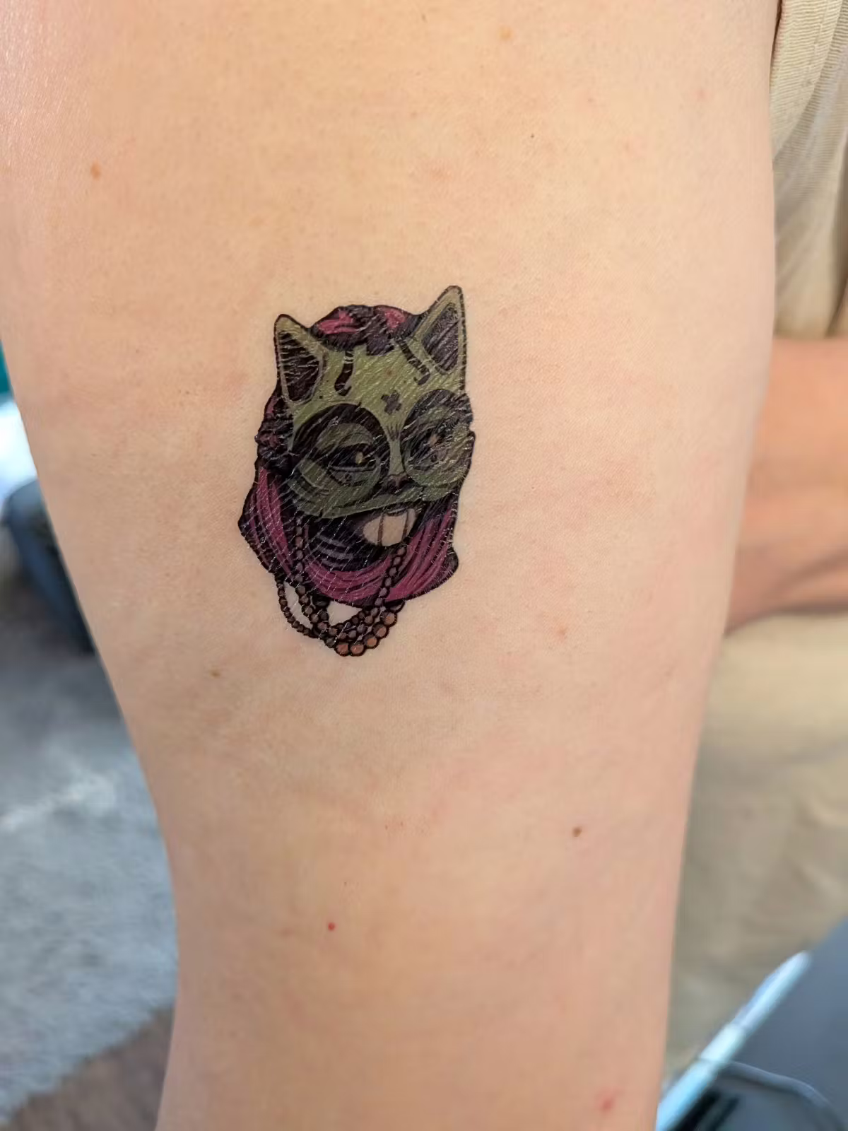  Detail of one of the mask temporary tatoos applied to an arm. 