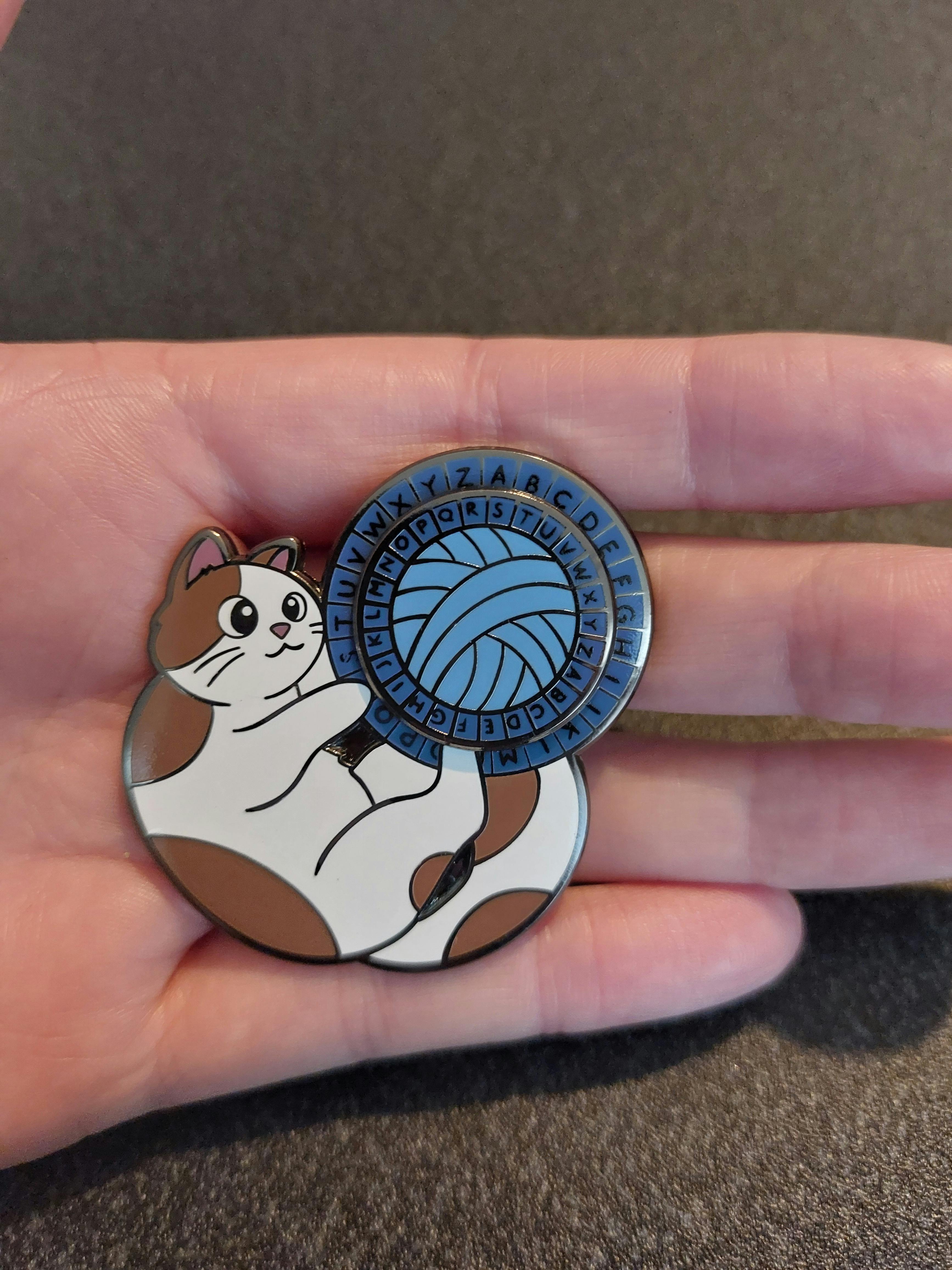 Cat Playing with Cipher Wheel Enamel Pin