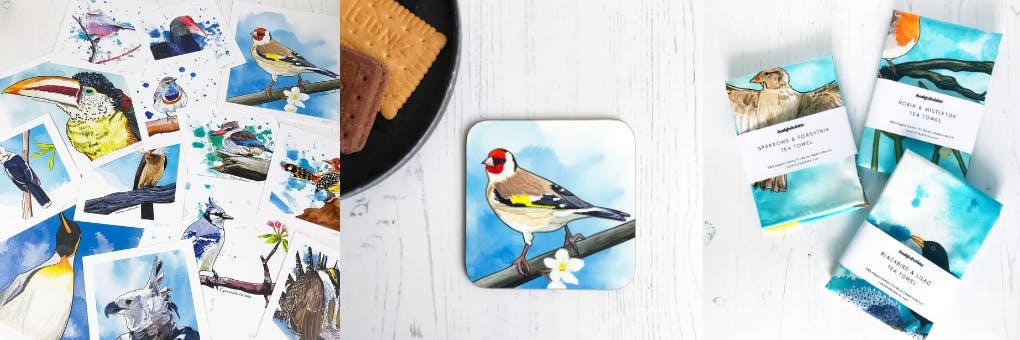 a montage of three photos from left to right they show a flat lay of vibrant, colourful illustration prints of birds from around the world, a european goldfinch on a branch illustration coaster and a series of folded and packaged tea towels with bird illustrations on them.