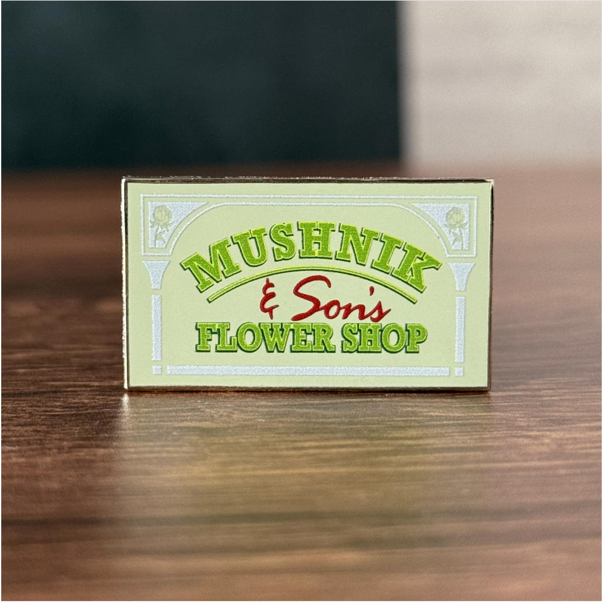 Mushnik Sign Pin
