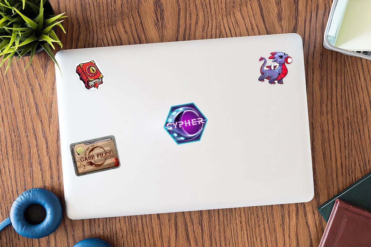 A mockup of a laptop with the four unlocked stickers on it.