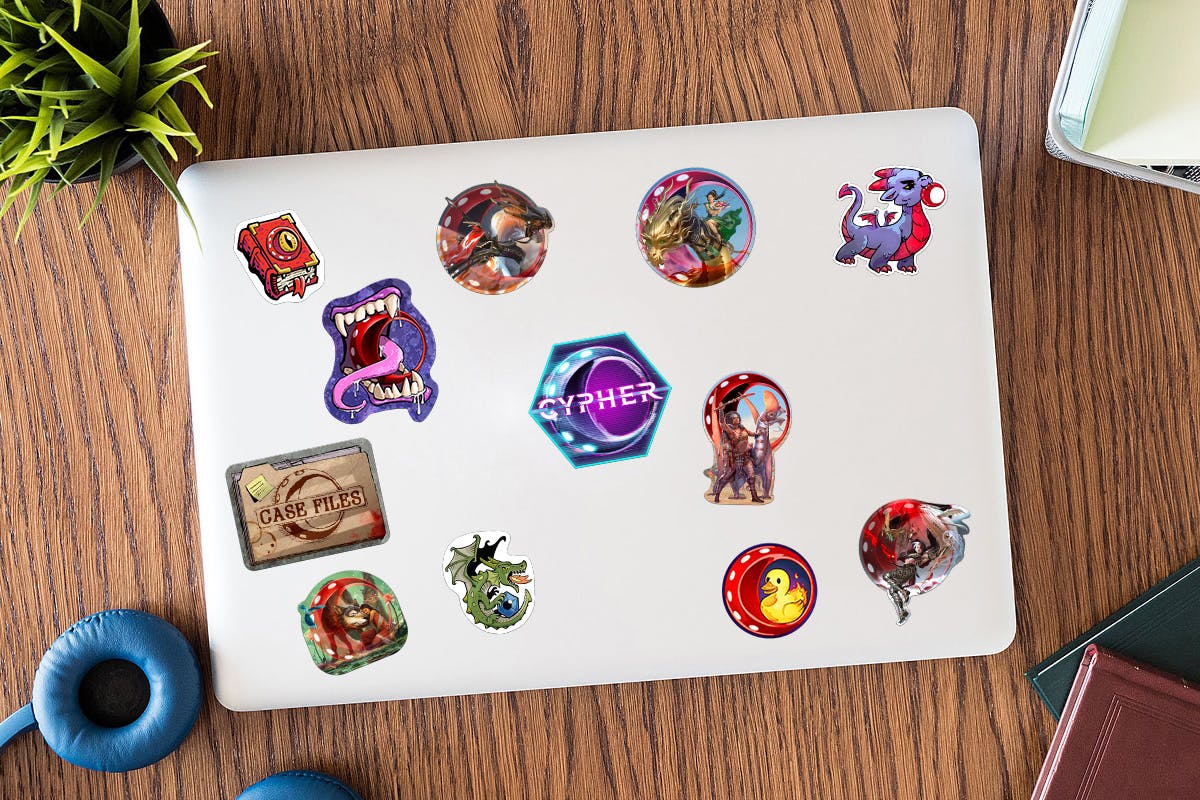 A mockup of a laptop with the twelve unlocked stickers on it.