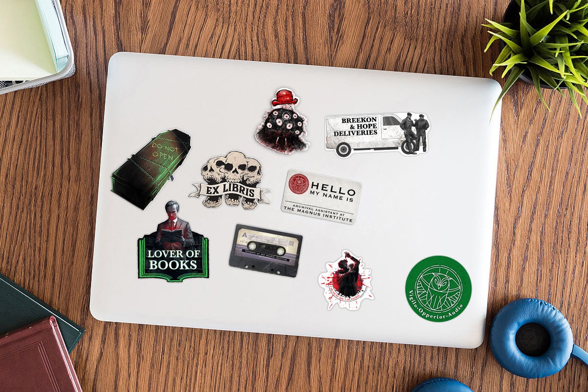 Image of laptop with nine stickers on it.