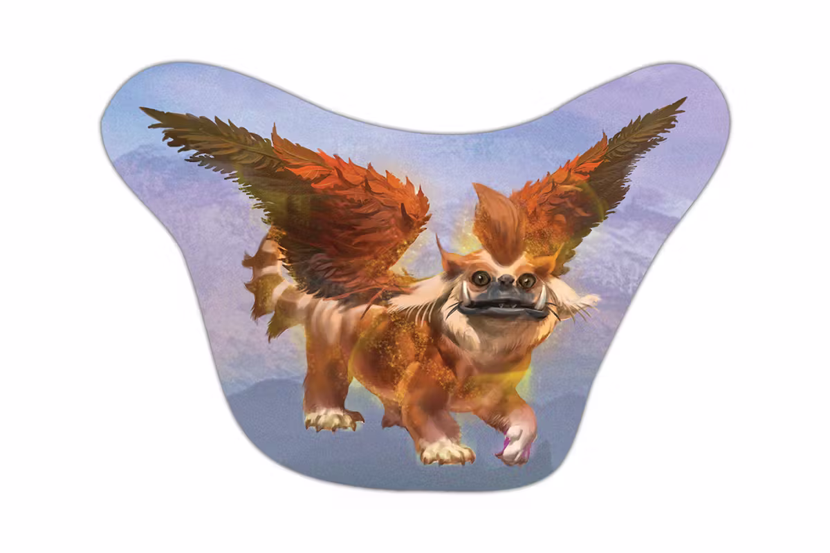 Sticker mockup showing a fantasy creature called a yishish that looks like a bit like a fanged housecat with feathery wings.