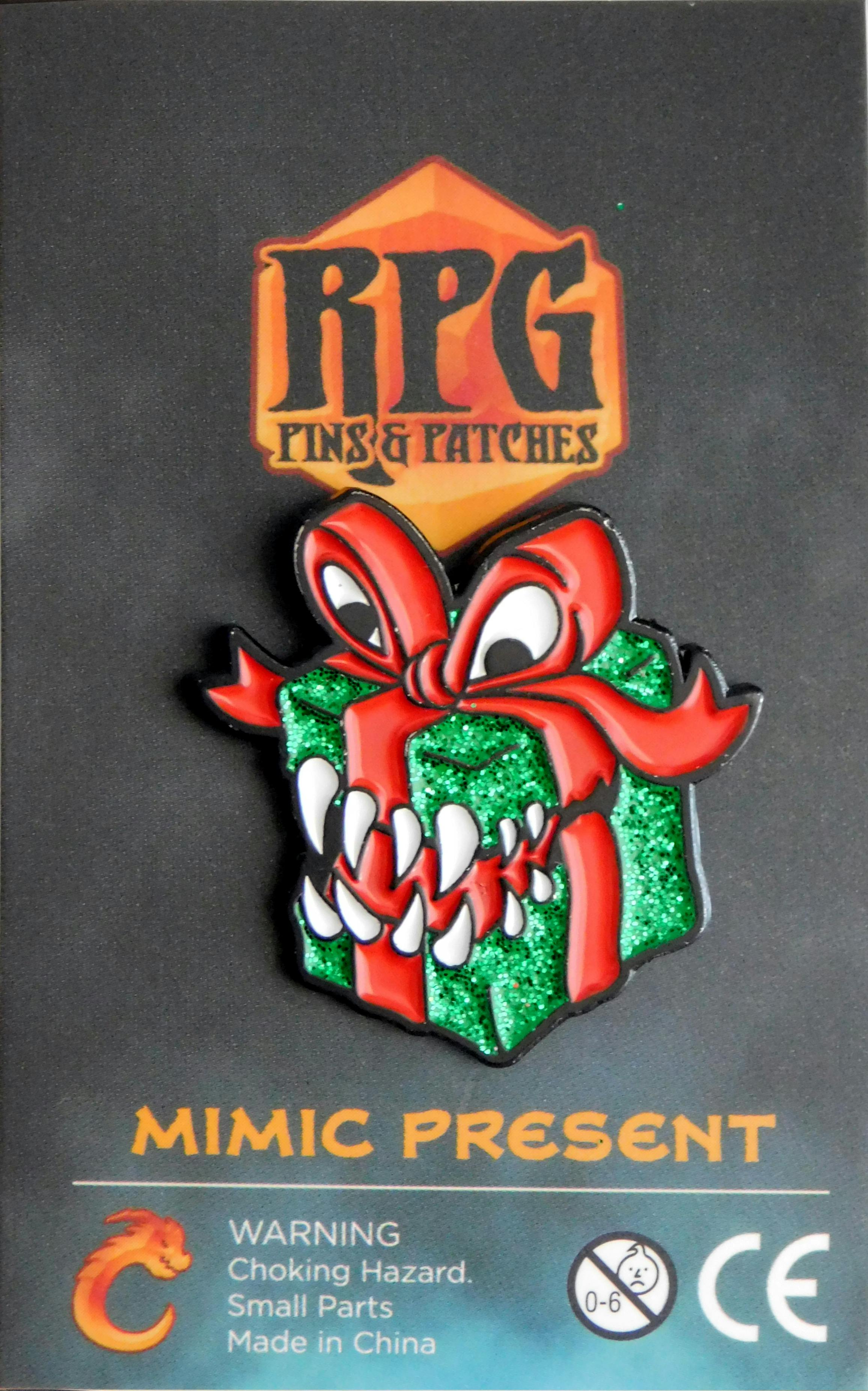 Mimic Present – Red & Green enamel pin