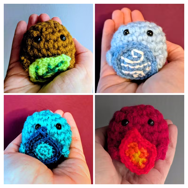  Each elemental sprite plushie on my hand, showing how little and sweet they are.
