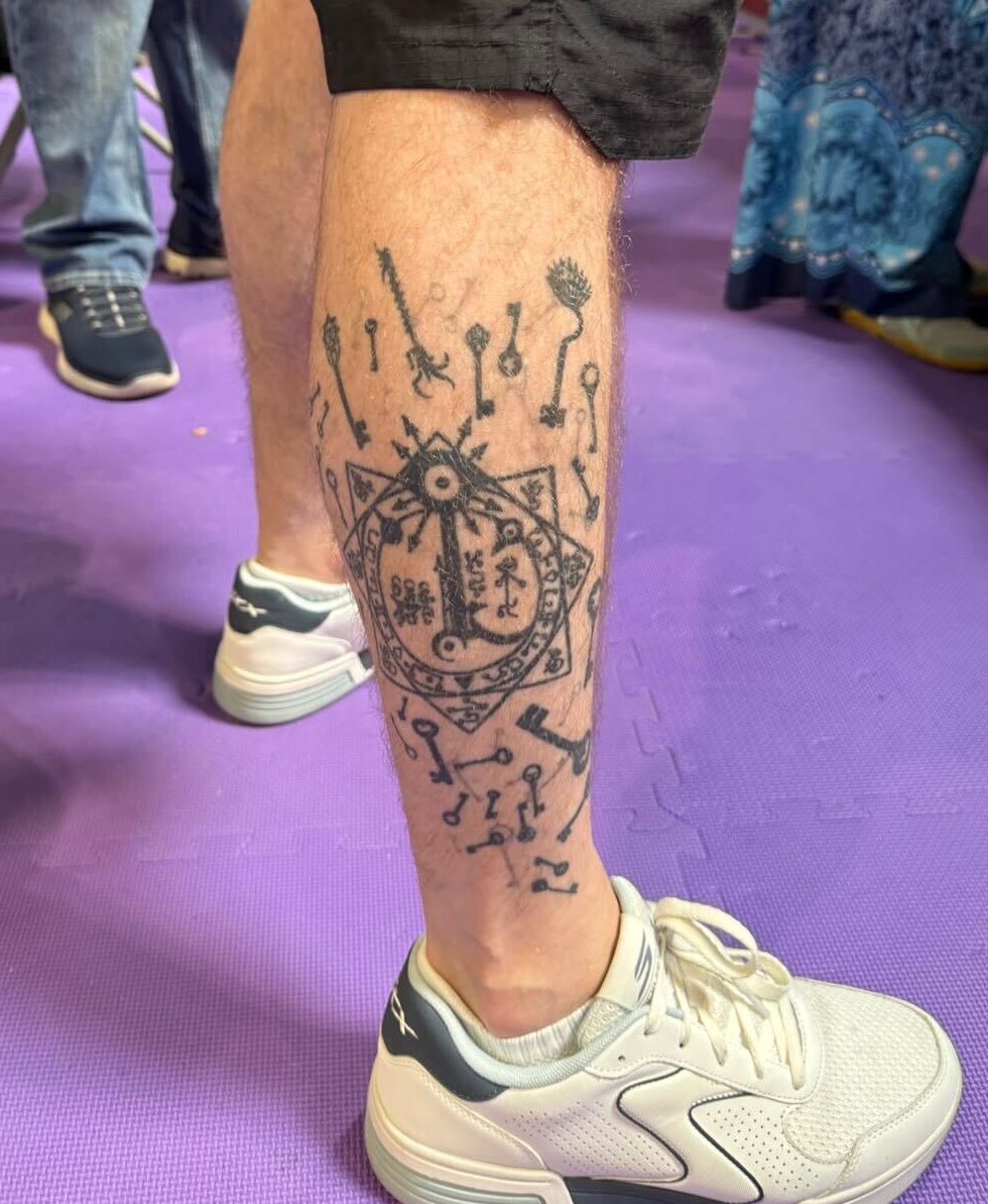 Invisible Sun tattoo in pride of place on the leg of a fan at UK Games Expo 2026