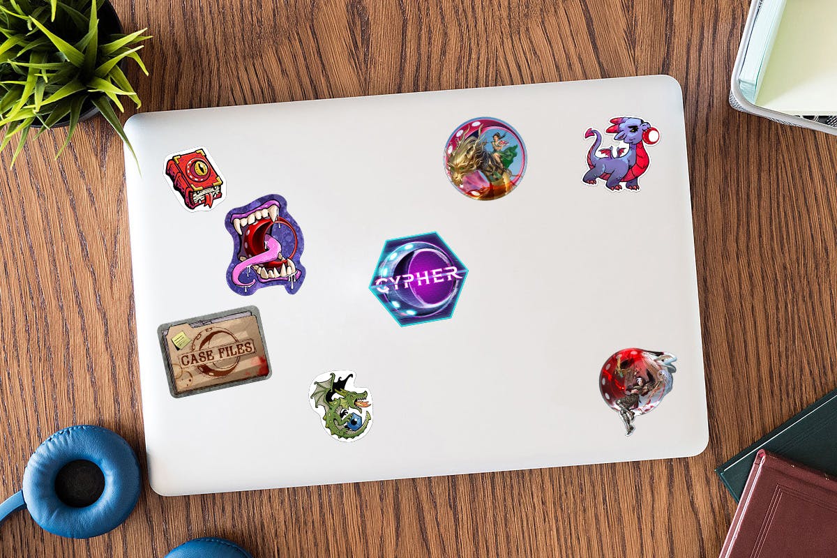 A mockup of a laptop with the eight unlocked stickers on it.
